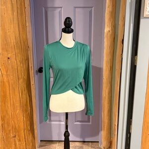 Green WILO crossover yoga/casual wear long sleeved top. With tulip hem.